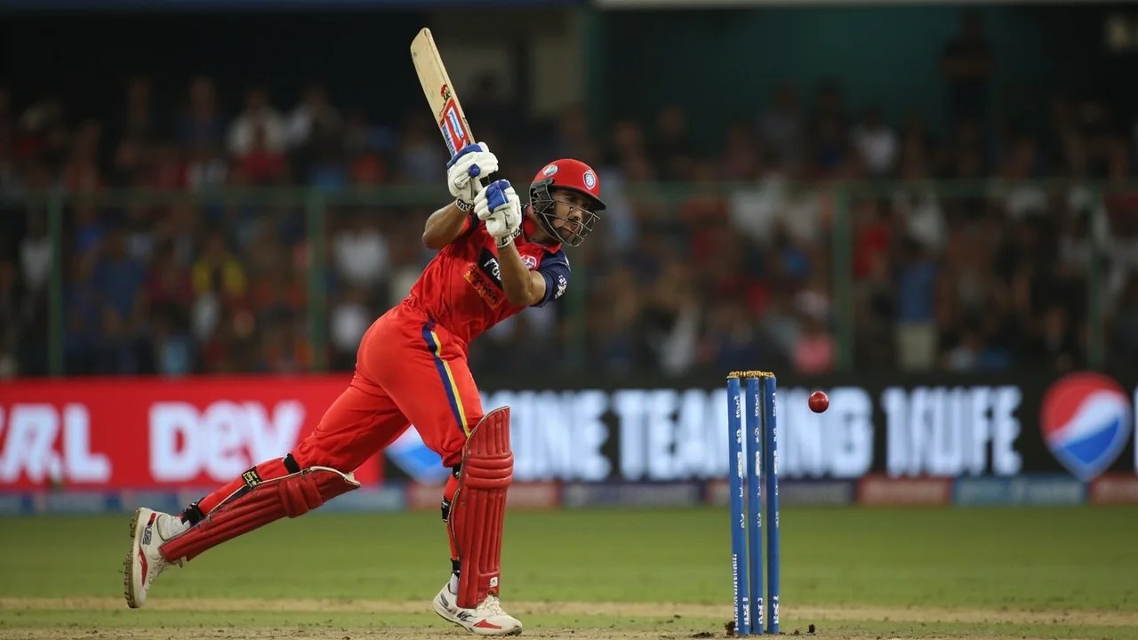 Tight sideline view of a star batsman playing a lofted shot during an IPL match, illustrating the kind of on-field moments that drive franchise value and sponsor interest